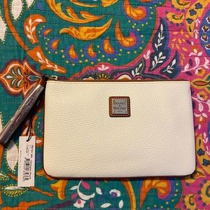 Dooney white pebbled leather Carrington pouch.with tassel.
